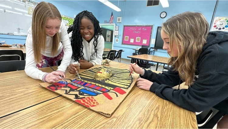 Sixth grade students paint a sarcophagus for extra specials at Marietta  Elementary School