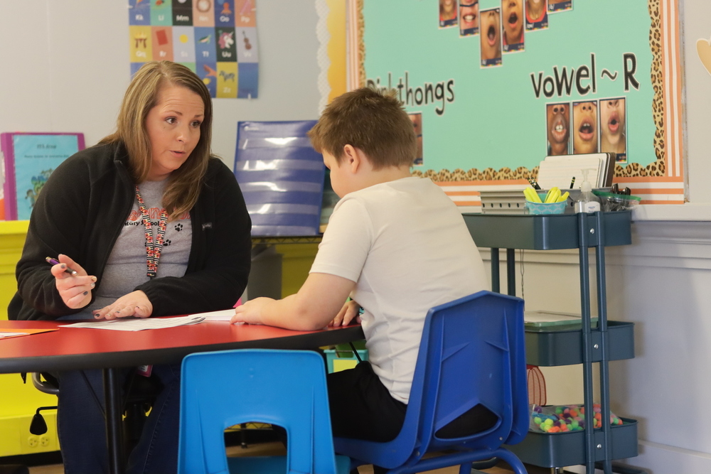 Emily Hopp works on reading intervention with a student