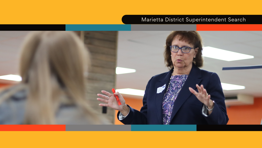 Woman talks in district superintendent search