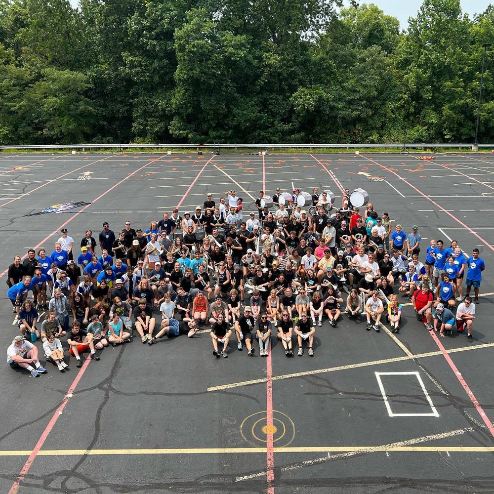 MHS Band members pose with Columbians Drum & Bugel Corps after a joint practice session